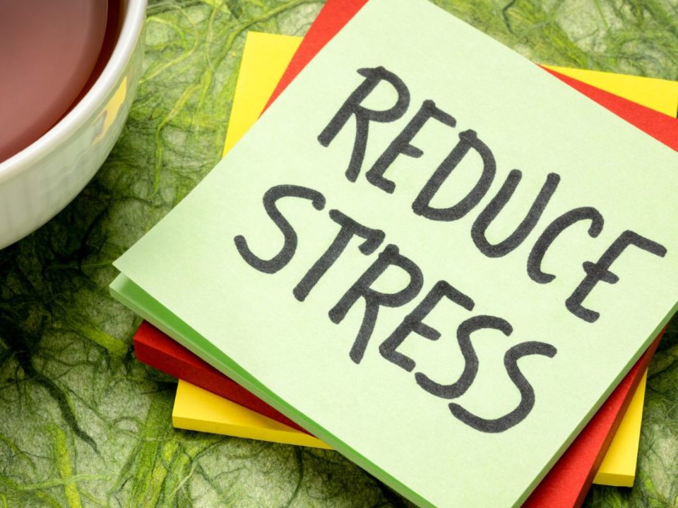 Reduce Stress written on a sticky note pad