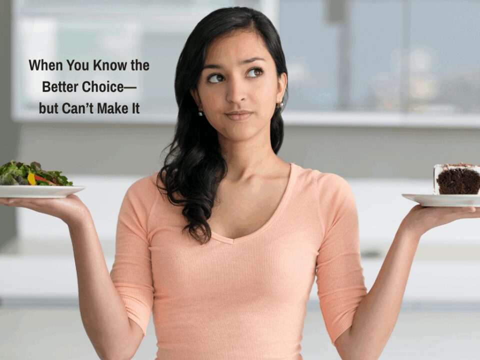 A woman deciding between eating a salad or a piece of cake